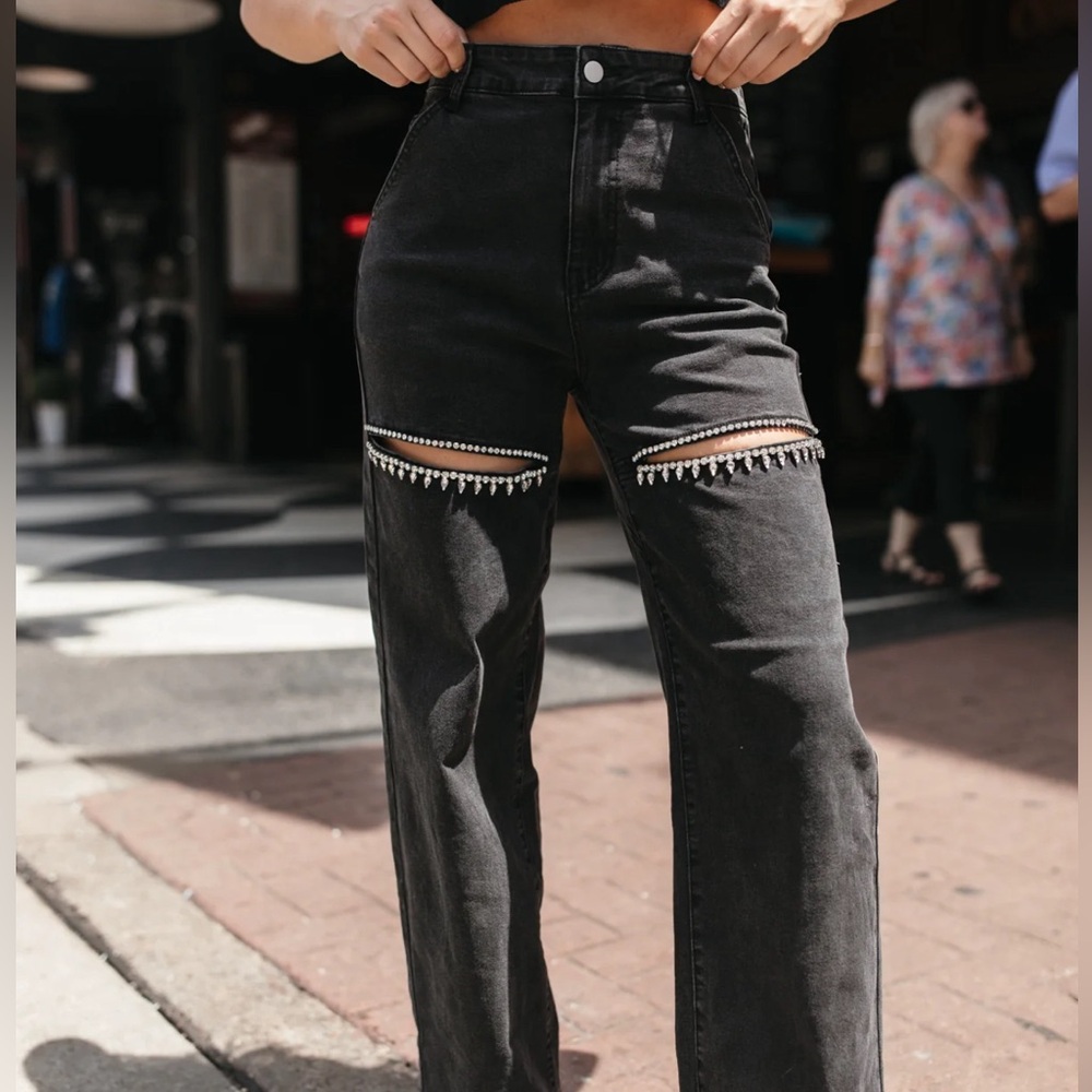 Black Studded Jeans feature a rhinestoned thigh slit